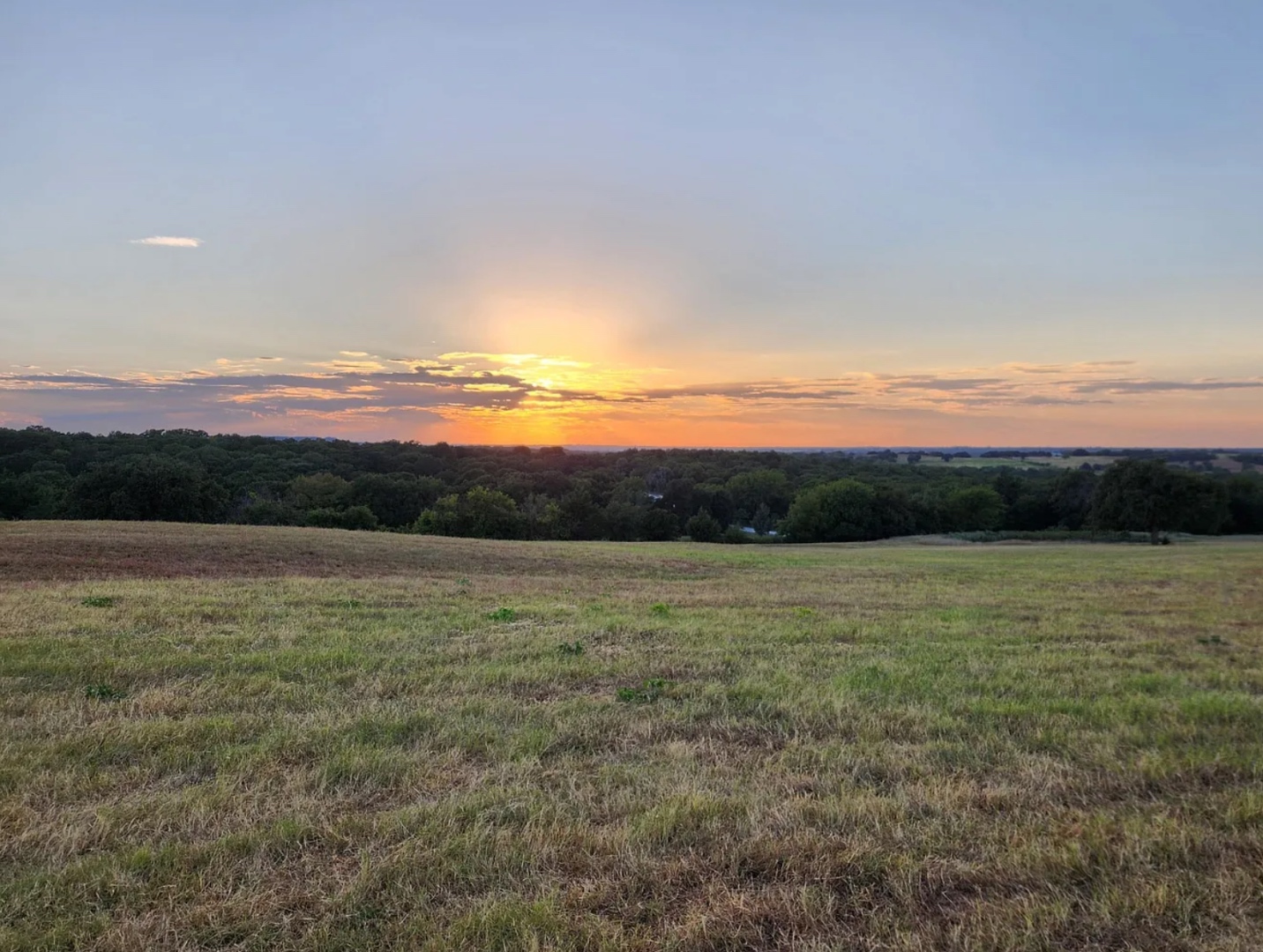 Sunset over the Bent Tree Ridge pasture and ridge.